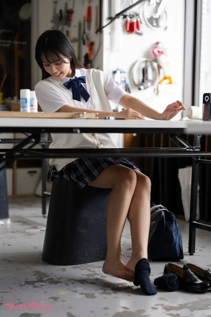 Kurumi Miyajima seated at an art-room desk