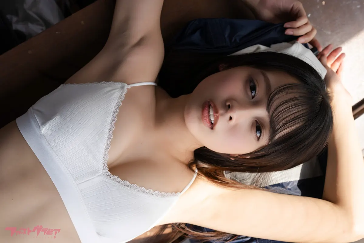 A close portrait of Kurumi Miyajima (宮嶋くるみ) reclining in window light. TOKIMEKURUMI (digital photobook) coverage.