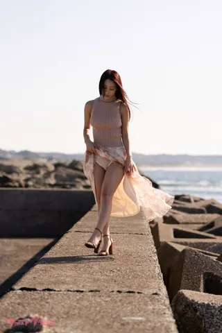Ayano Sumida (澄田綾乃) on a coastal walkway in the SOLARIA digital photobook preview