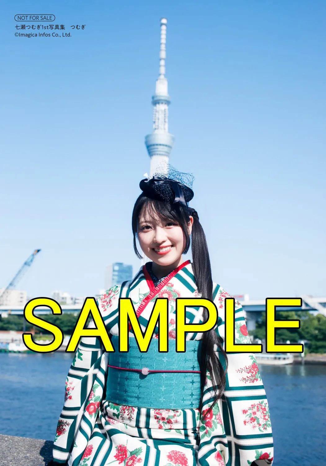 Shosen photographic print sample for Tsumugi, showing Tsumugi Nanase in a patterned kimono beside a river with Tokyo Skytree behind her, marked SAMPLE.
