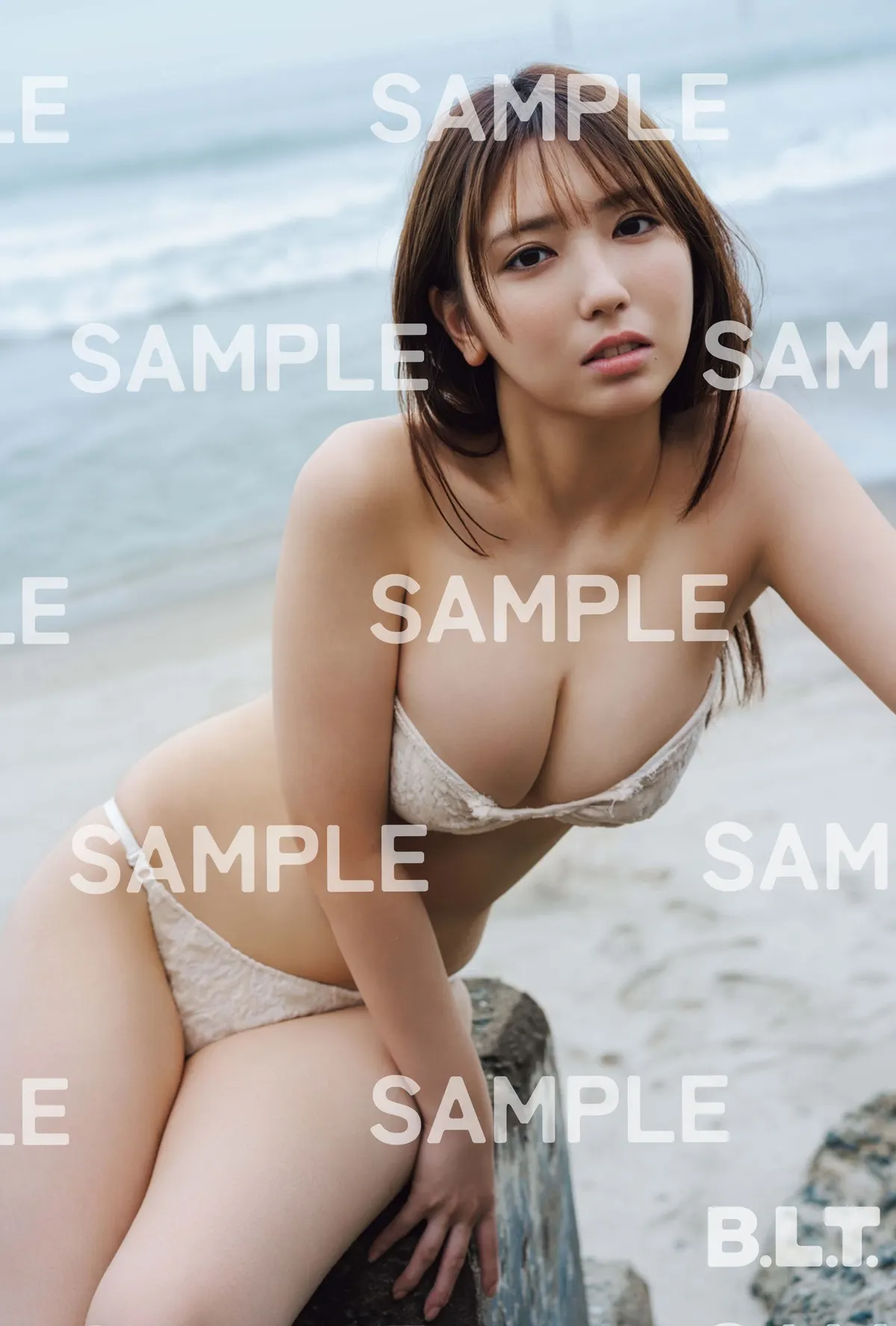 BLTISM VOL.1 Seven Net postcard sample C shows Aika Sawaguchi in pale swimwear beside the sea, with B.L.T. and SAMPLE markings.