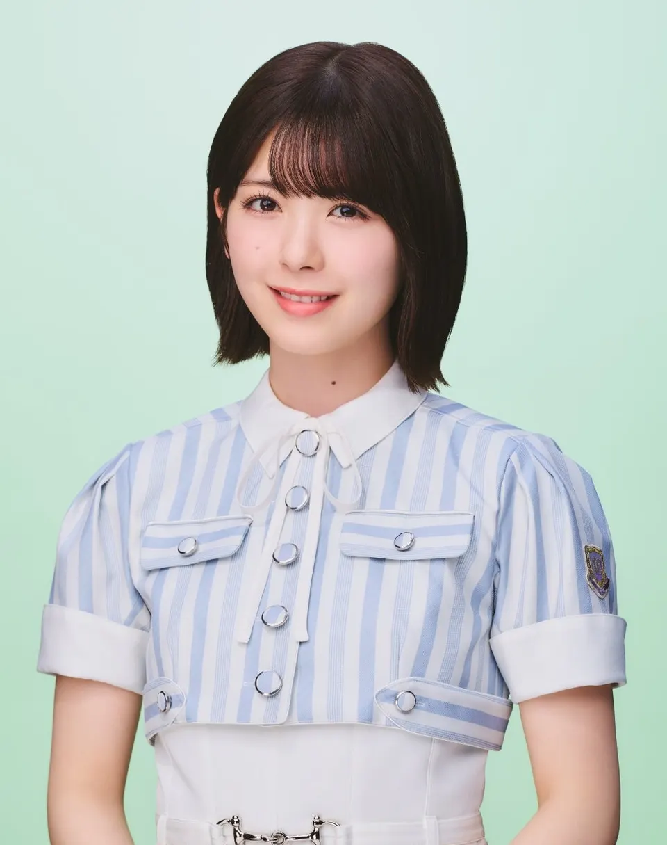 Ayame Tsutsui wearing a pale blue-and-white striped outfit against a mint-green background.