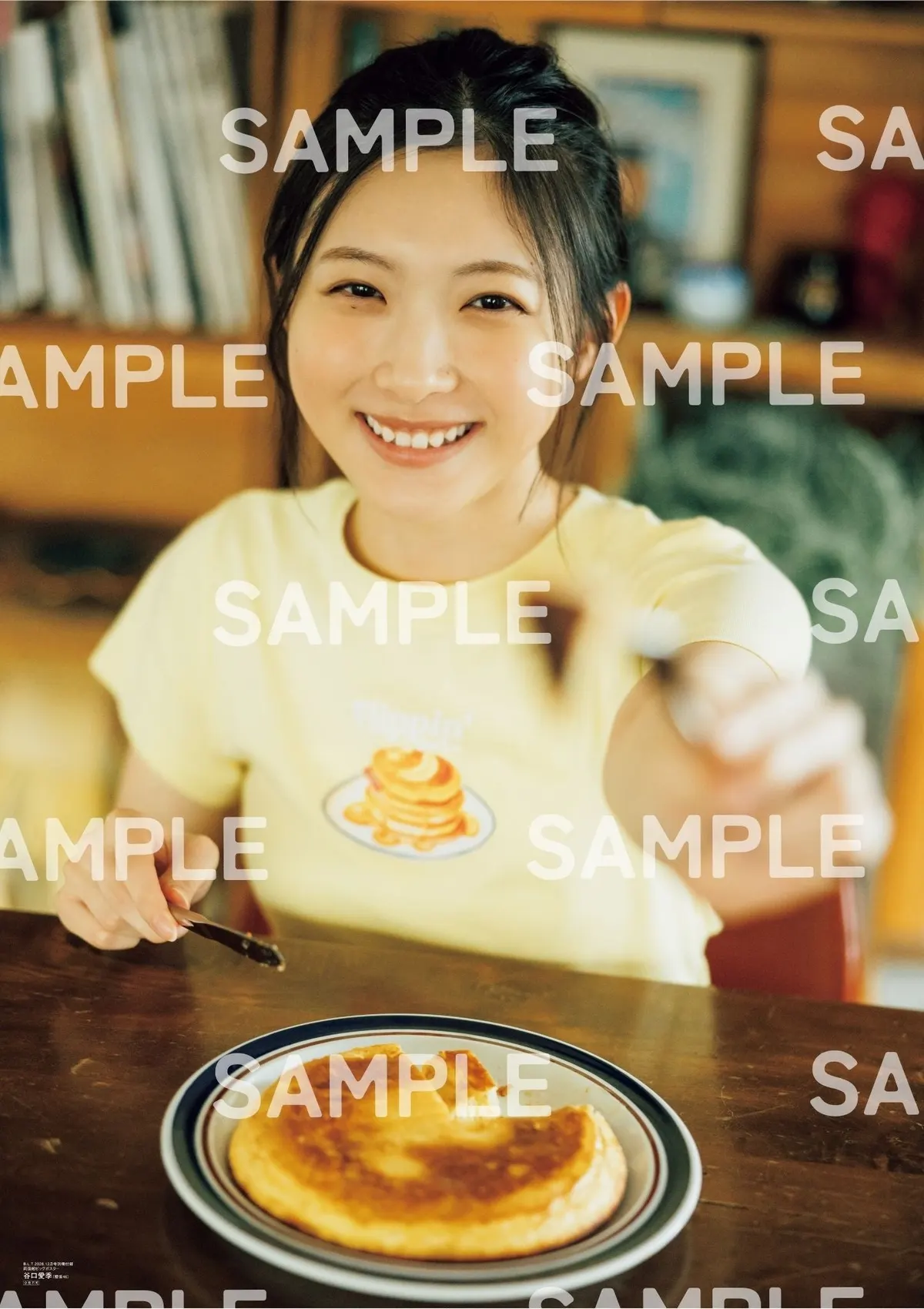 B.L.T. December 2026 poster sample showing Airi Taniguchi smiling and extending a fork across a pancake, with SAMPLE markings.