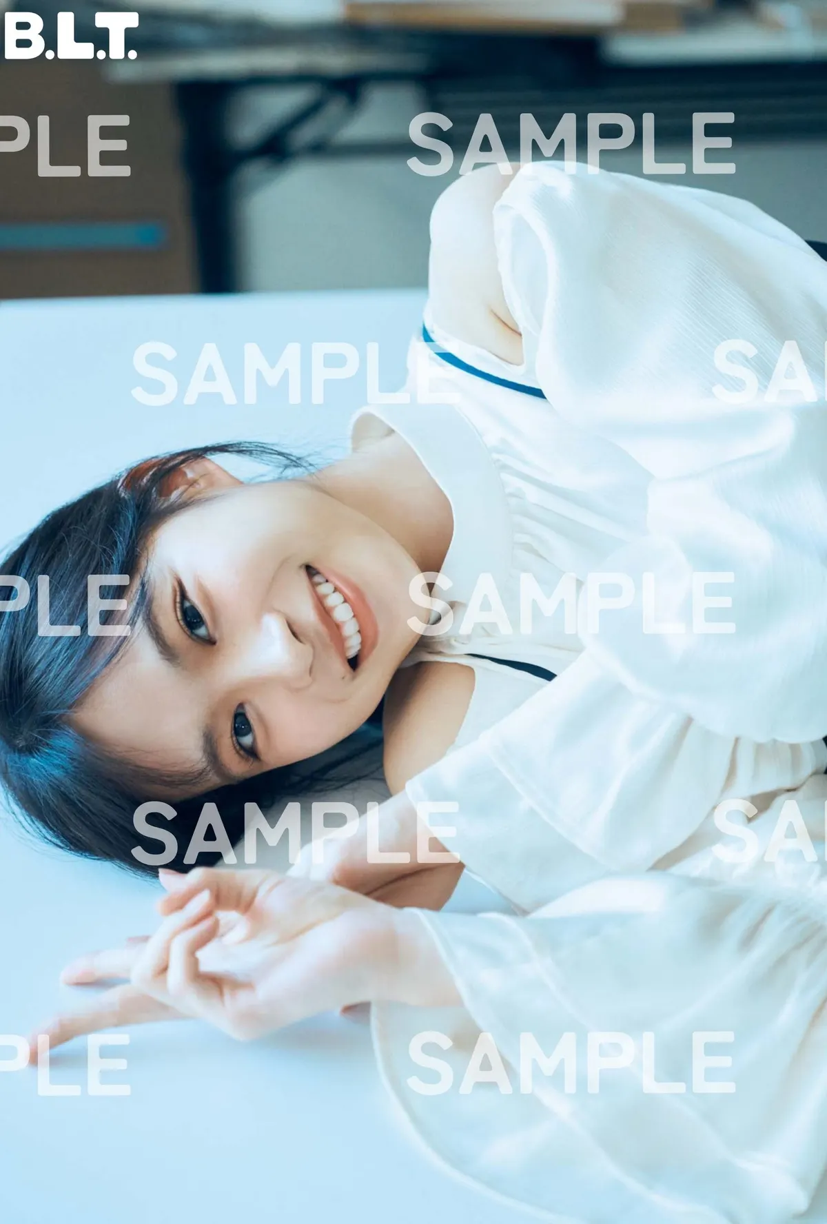 SAMPLE-marked HMV Wako Matsumoto postcard, showing her reclining in white and dark blue clothing.